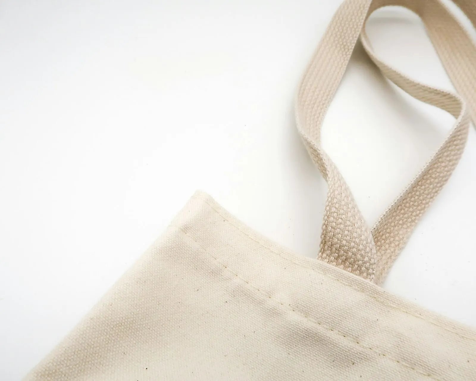 Brown tote bag on a pale surface